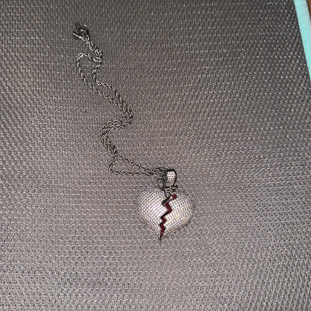 Im selling football jerseys, Jordans, a hoodie, and a broken heart chain